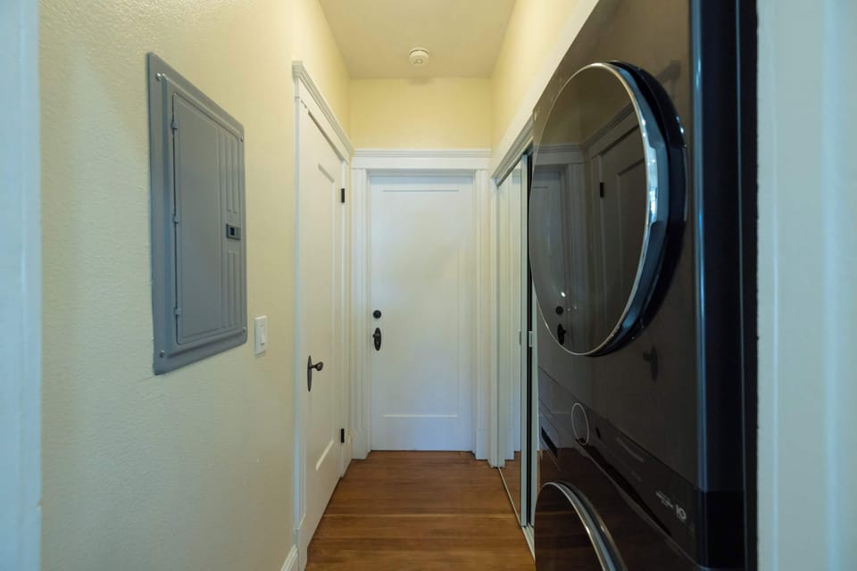 A convenient in-home laundry area with a stacked washer and dryer makes longer stays comfortable and stress-free