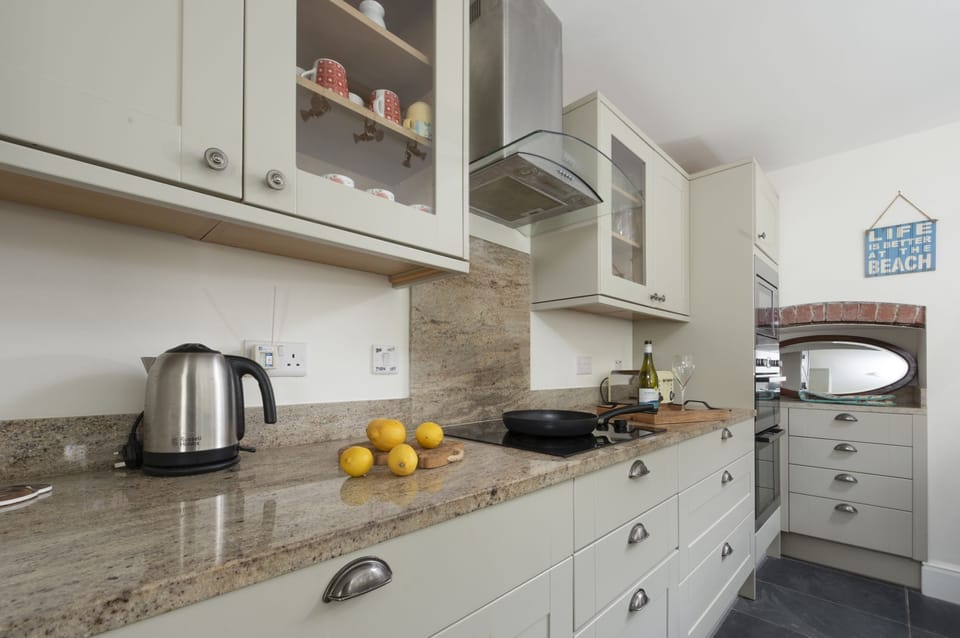microwave, toaster, kettle, and Nespresso pod coffee machine - Trevethen Cottage