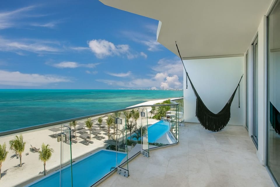 Sway in the hammock while waves shimmer below.