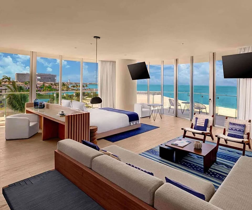 Wake up to sunrise spilling across your panoramic suite.