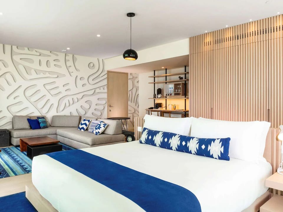 Lounge comfortably in your open-plan suite with coastal style.