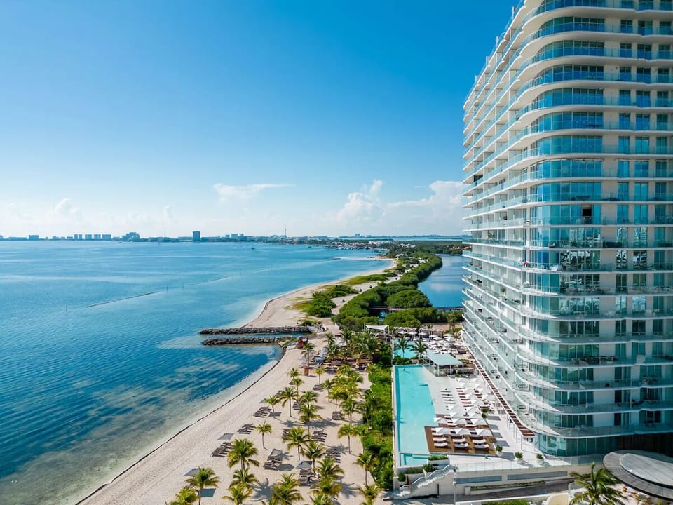 Soak up ocean breezes beside the beachfront pool and loungers.