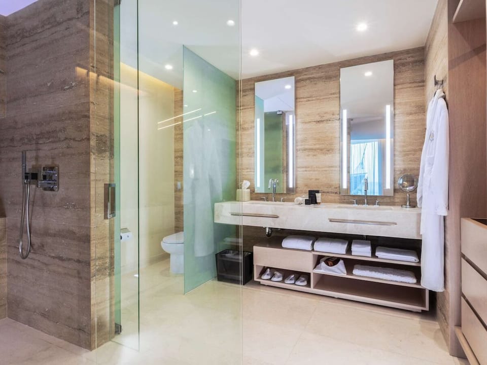 Indulge in a glass-walled shower with hotel-fresh comfort.