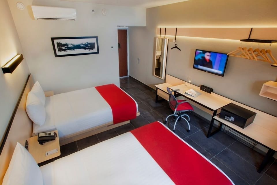 Relax with in-room TV and cool air-conditioning comfort.