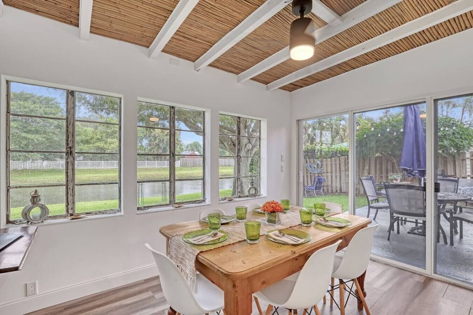 The dining area offers seating for six in a bright, inviting space, perfect for enjoying home-cooked meals or takeout from nearby restaurants.
