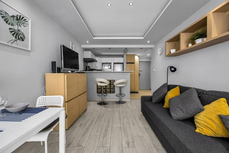 Living Room with Full Sofa Bed, Smart TV and Dining Space | Book Now with RENTUJEMY.COM