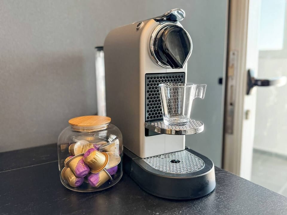 Nespresso machine and pods offered for your convenience.