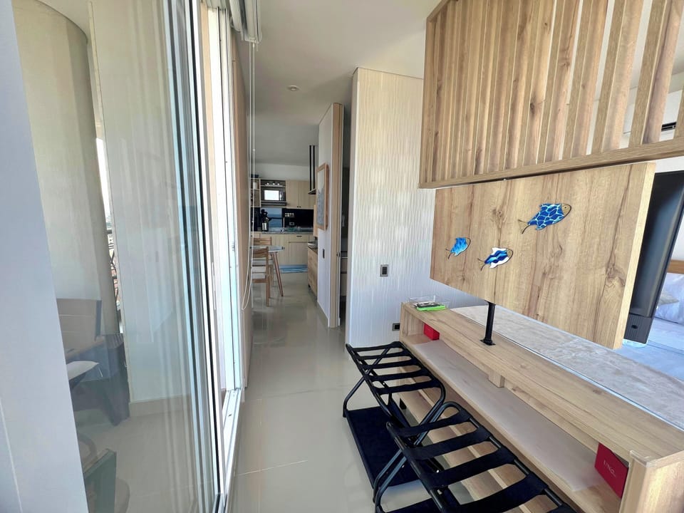 The bedroom has also 2 metallic luggage racks for your convenience and a balcony