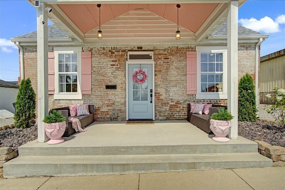 Rosé off Main welcomes you with vintage charm and a soft blush-pink glow.