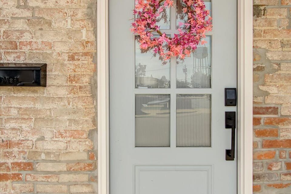 Downtown charm meets privacy with our light-filled, frosted glass front door.