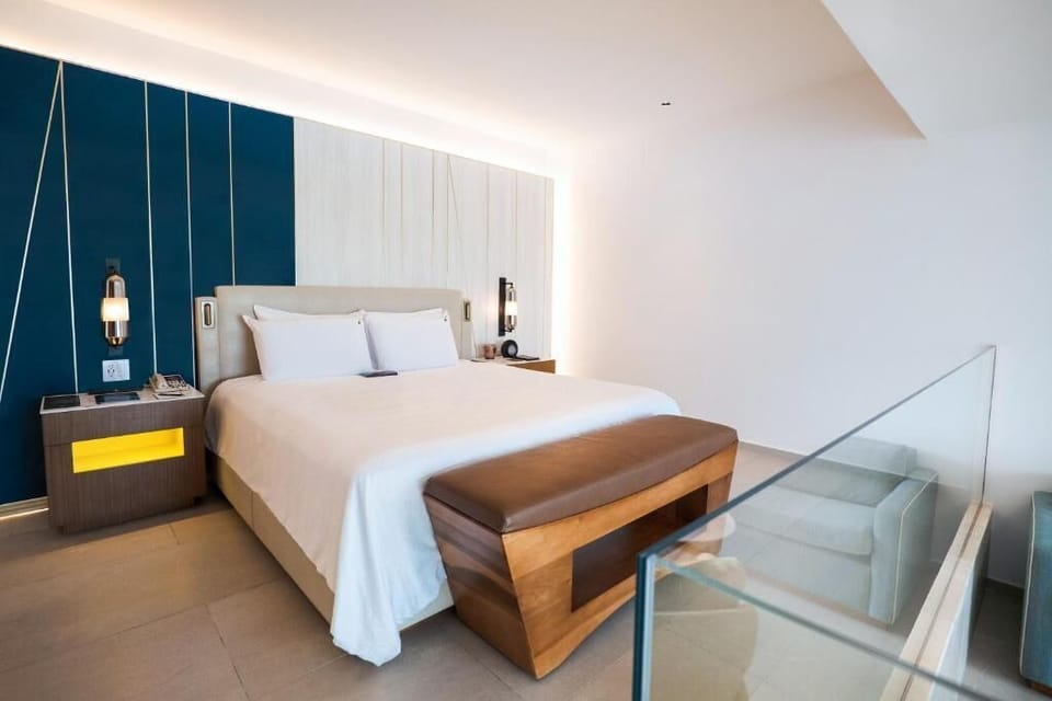 Enjoy a spa-like bathroom with sleek finishes and plush robes.