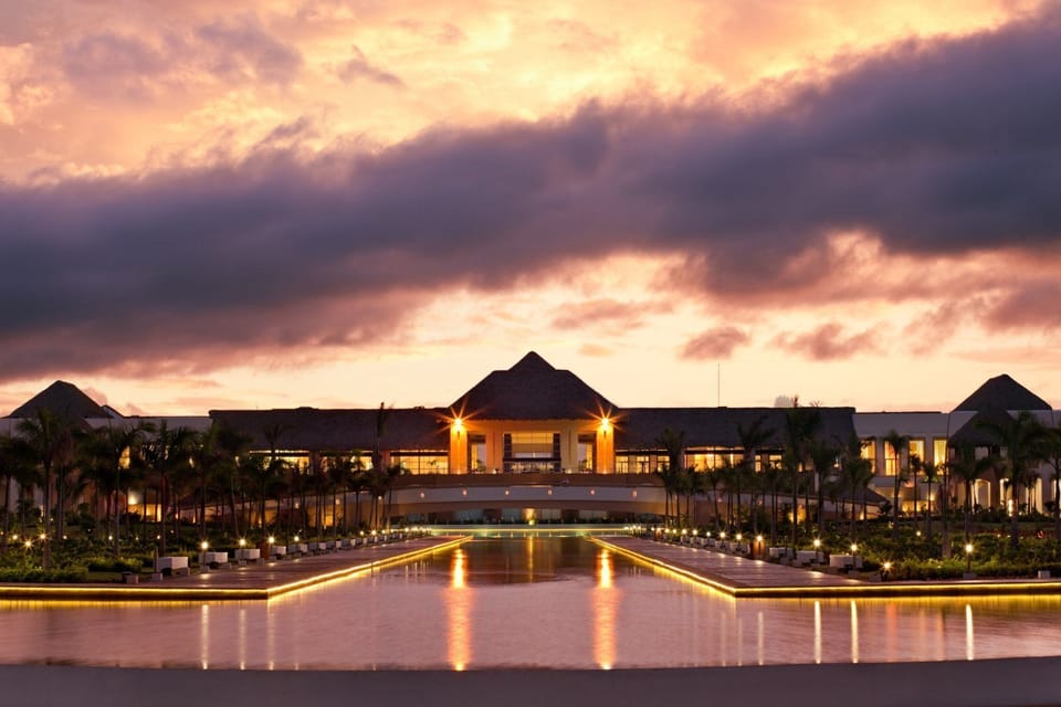Soak up golden-hour views across a serene waterfront entrance.