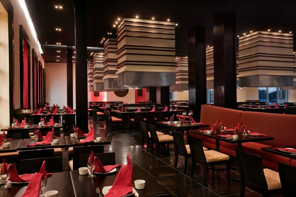 Enjoy intimate dinners in a sleek space with dramatic lighting.
