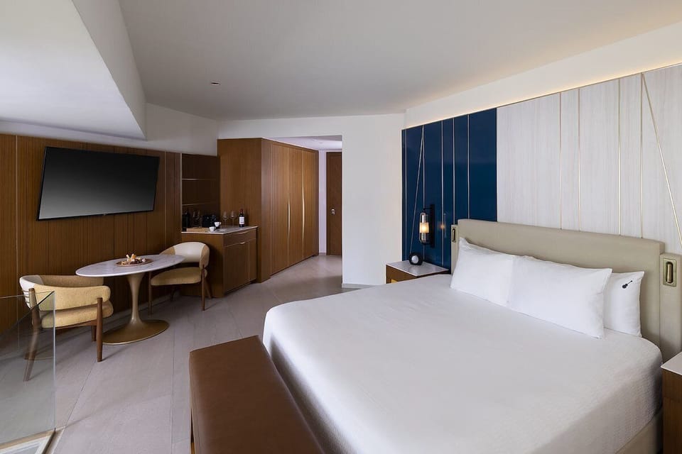 Settle in with a cozy bed and convenient in-room refreshment bar.