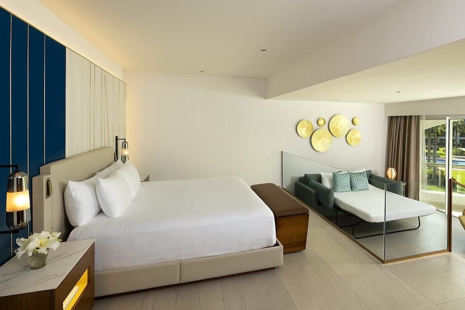 Relax into a spacious bedroom with sleek, sunlit comfort.