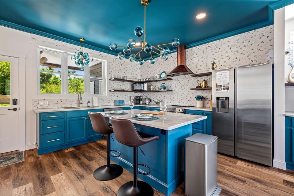 Bright colors, natural light, and custom finishes make the kitchen one of our favorite spaces.