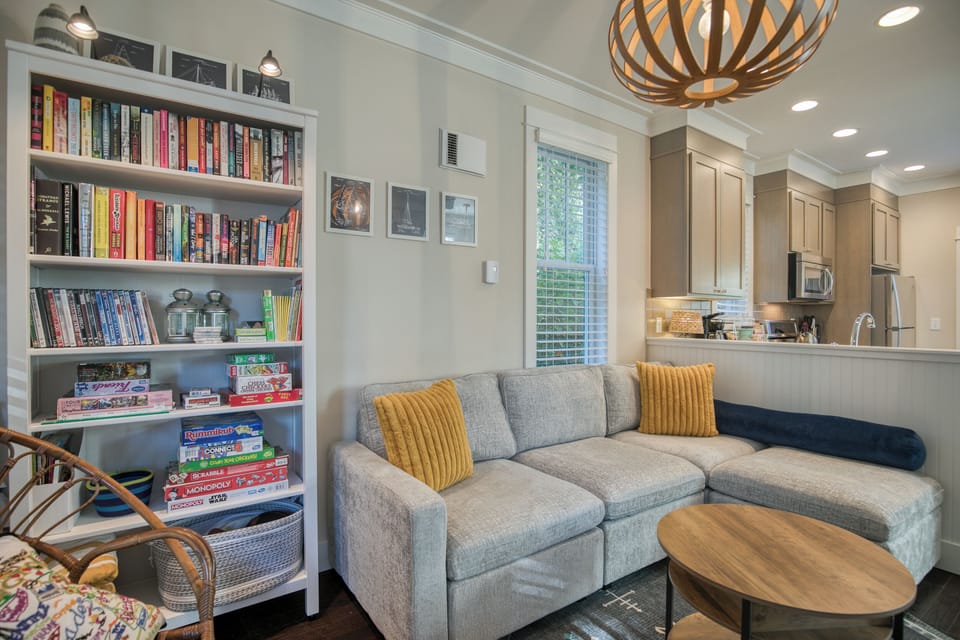 The living room with seating, books, DVDs, games, & puzzles. 