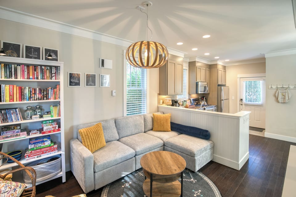 The living room is an open concept with the kitchen and dining room. 