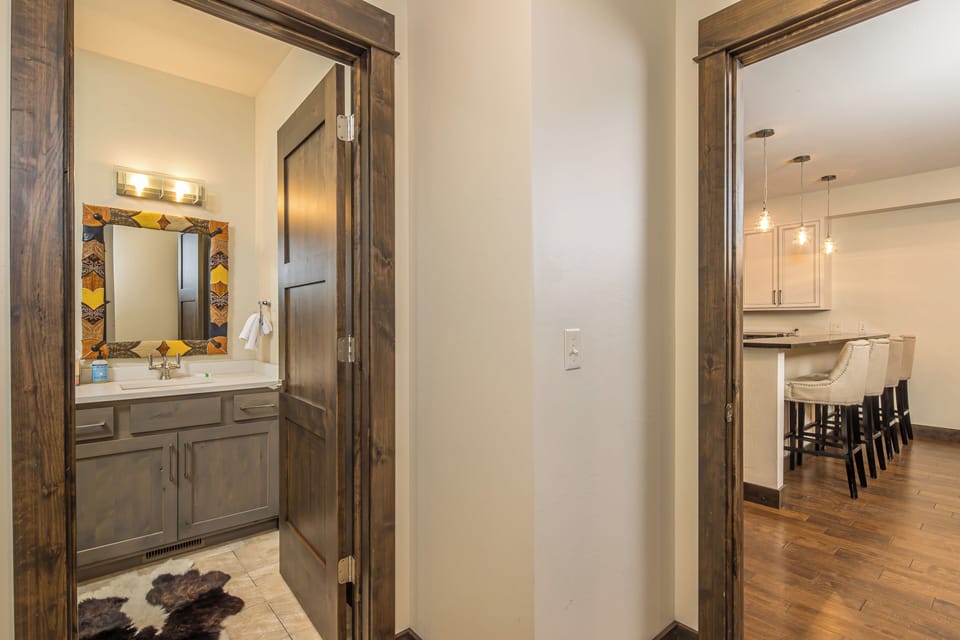 Half bathroom adjacent to the great room | Main Level