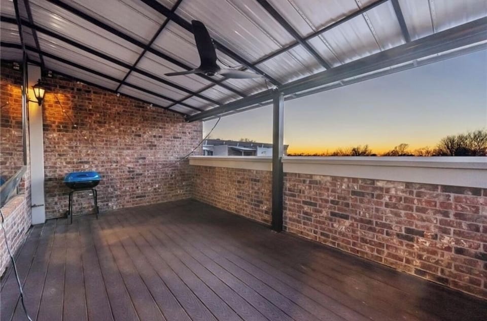 Outdoor covered patio with electric shades allows for 3 season enjoyment