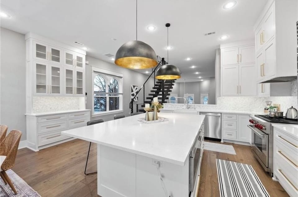 Oversize gourmet kitchen is often the gathering point for planning  or recapping