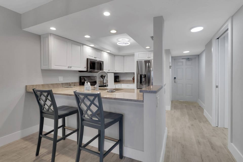 A pass-through eating bar divides the kitchen from the main living space.