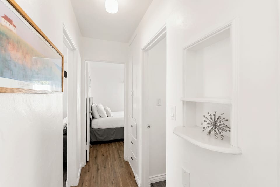 Hallway with bathroom door in middle