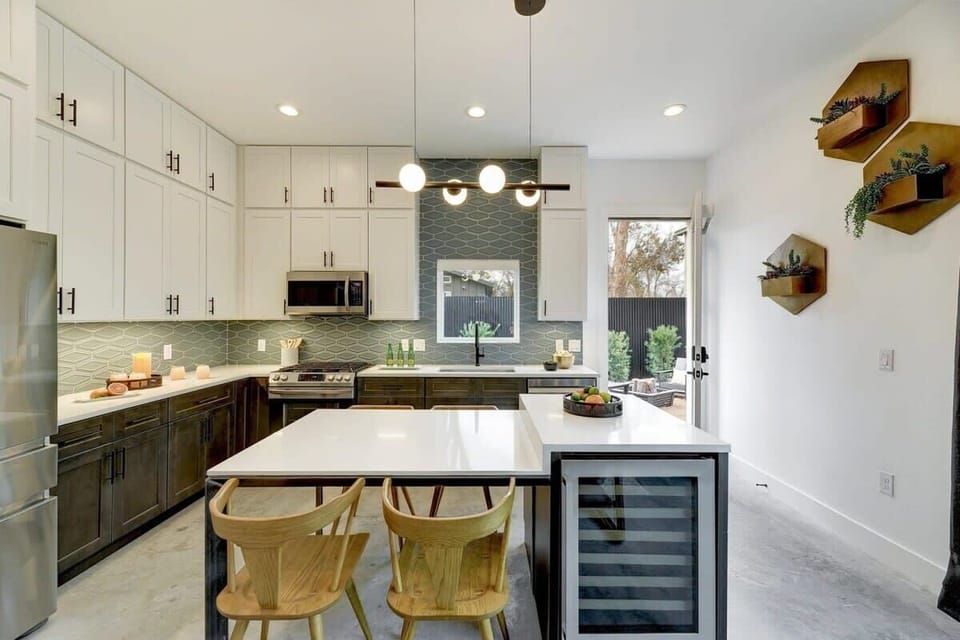 Chef's kitchen with large island and wine cooler