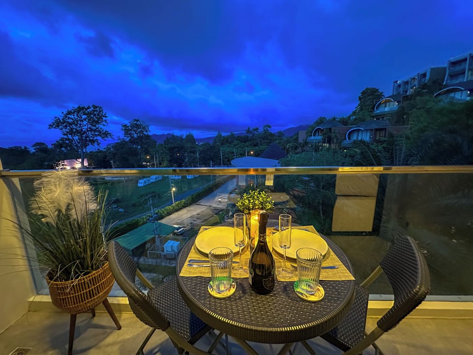 Romantic candlelight dinner with a sea breeze and mountain glow.