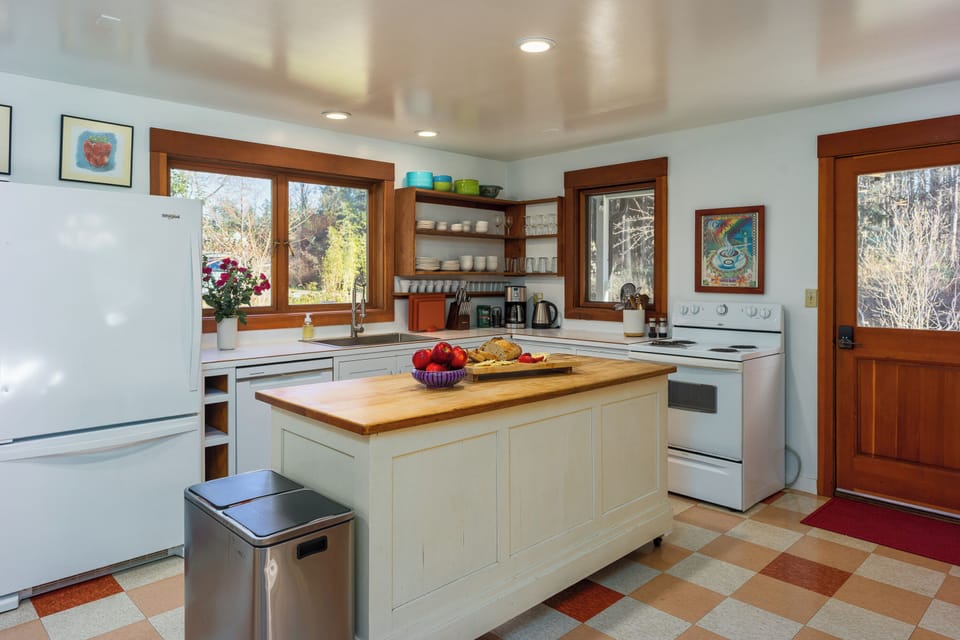 Country kitchen with plenty of counter space and coffee bar.