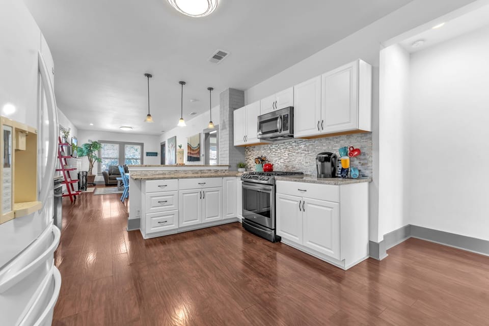 Spacious modern kitchen with updated appliances and ample counter space.