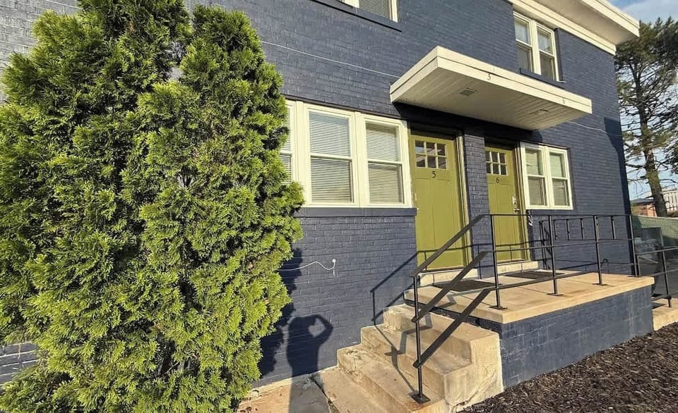 Green doors invite easy exploration of city secrets.