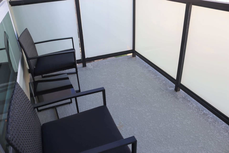 Enjoy stunning views of the iconic city from your own private balcony