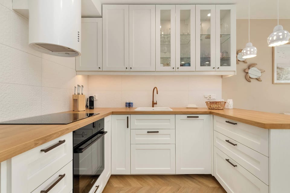 The sleek design of the kitchenette blending seamlessly with the living area.