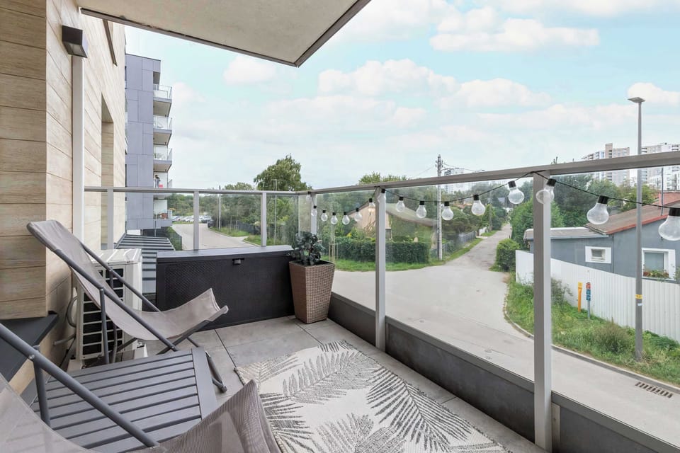 The balcony's stylish design complements the apartment's decor.