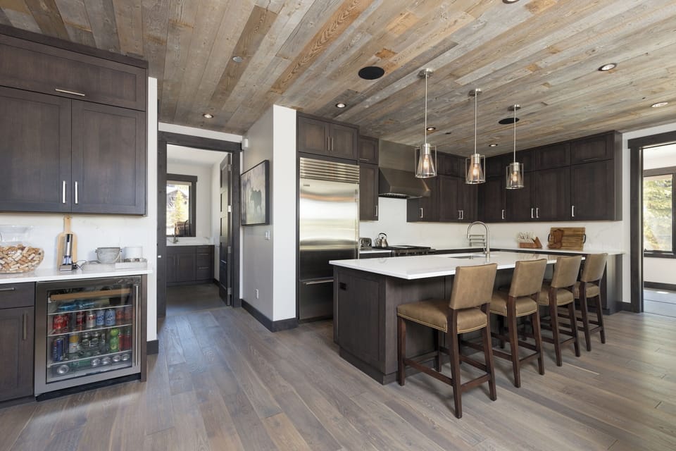 Open Concept Kitchen, Entry to Laundry Room and Mini Bar Area