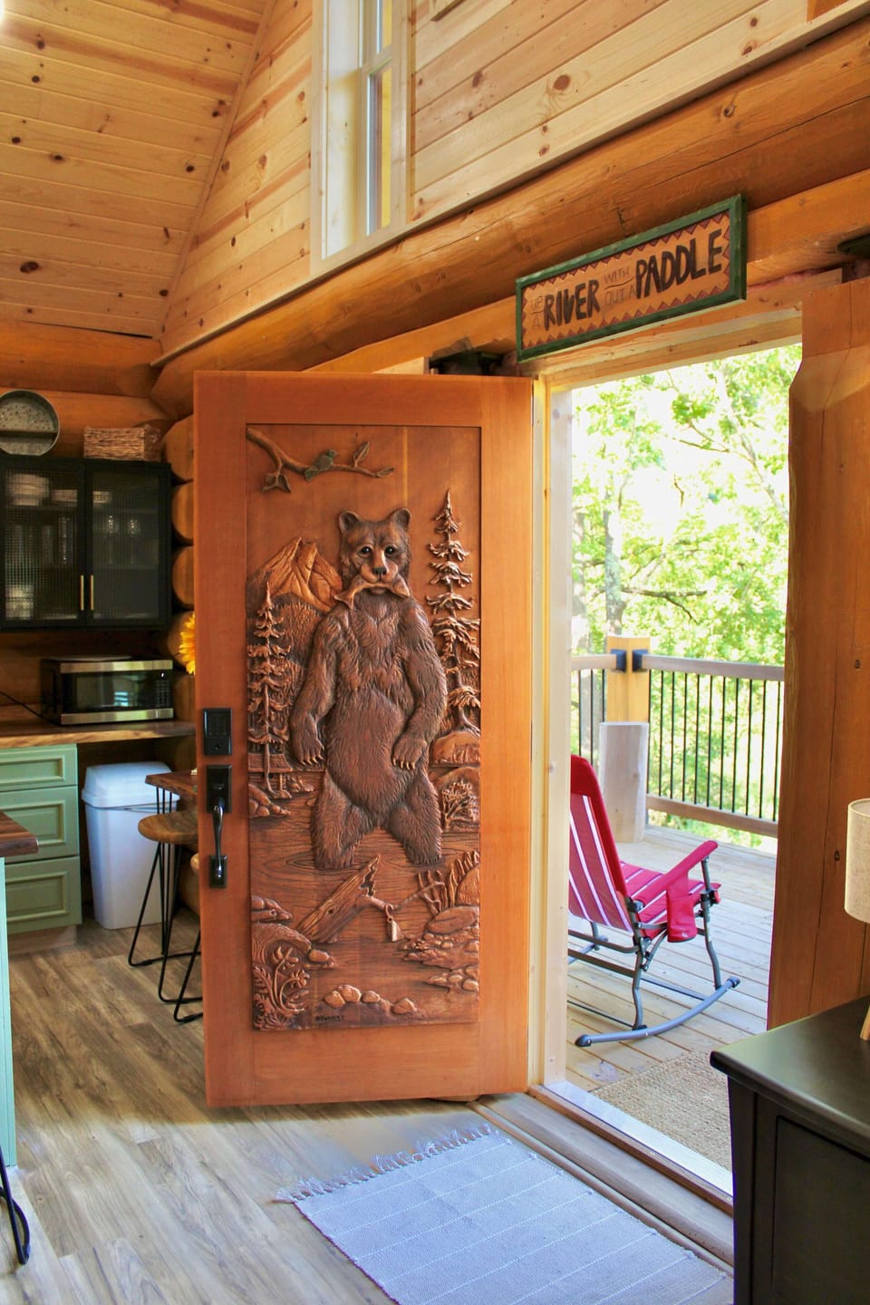 One of the most unique features of this custom Log Home is this hand carved front door by a skilled Canadian Artisan. Each detail was carefully crafted to reflect both beauty and craftsmanship, making it a true piece of art. 