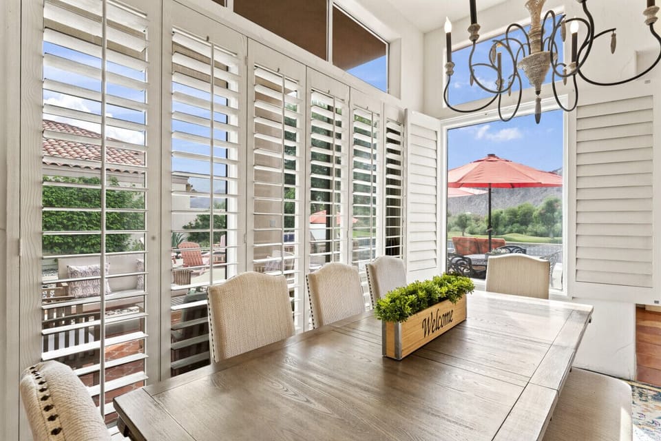 Bright dining nook w/ shutters & easy access to the outdoor patio