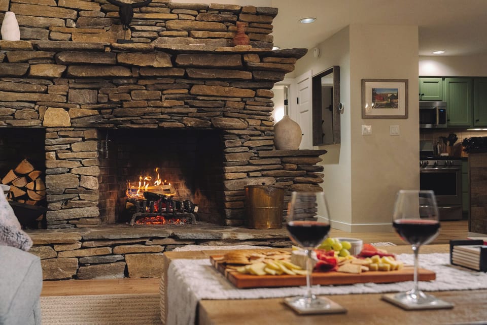 Cozy up next to the custom stonework wood-burning fireplace