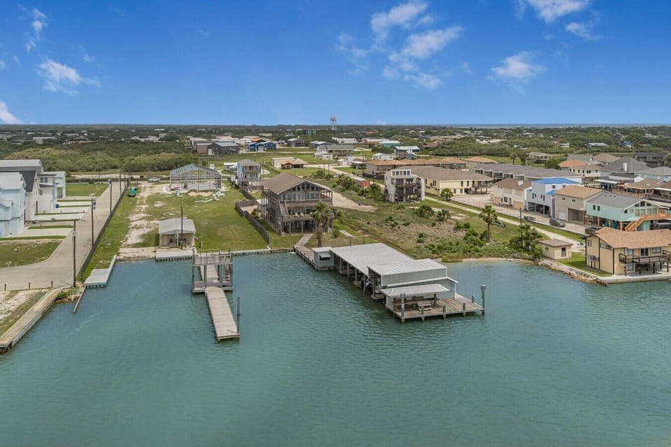 A true waterfront stay with the boathouse just steps from the home and open water beyond.