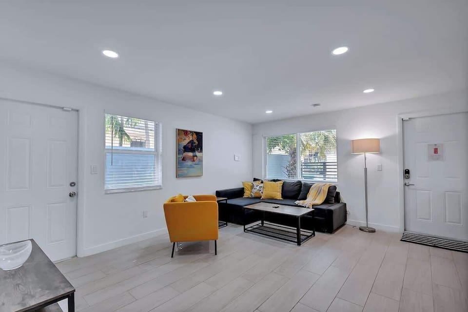 Bright and inviting living space with a smart TV and cozy seating—ideal for downtime or movie nights.