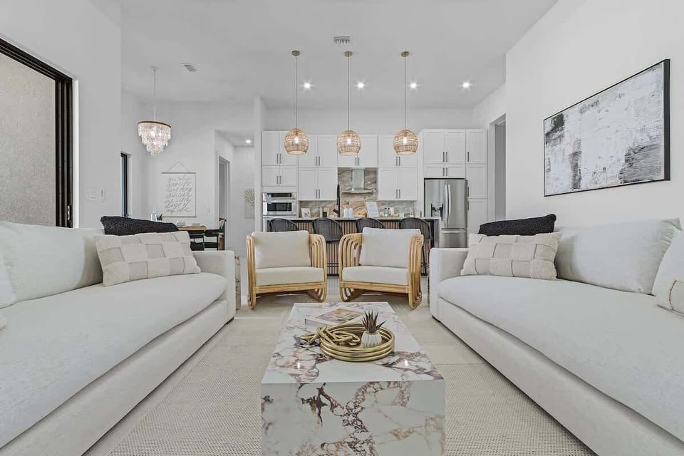 Spacious living room with cozy seating and a smart TV for relaxing nights in.