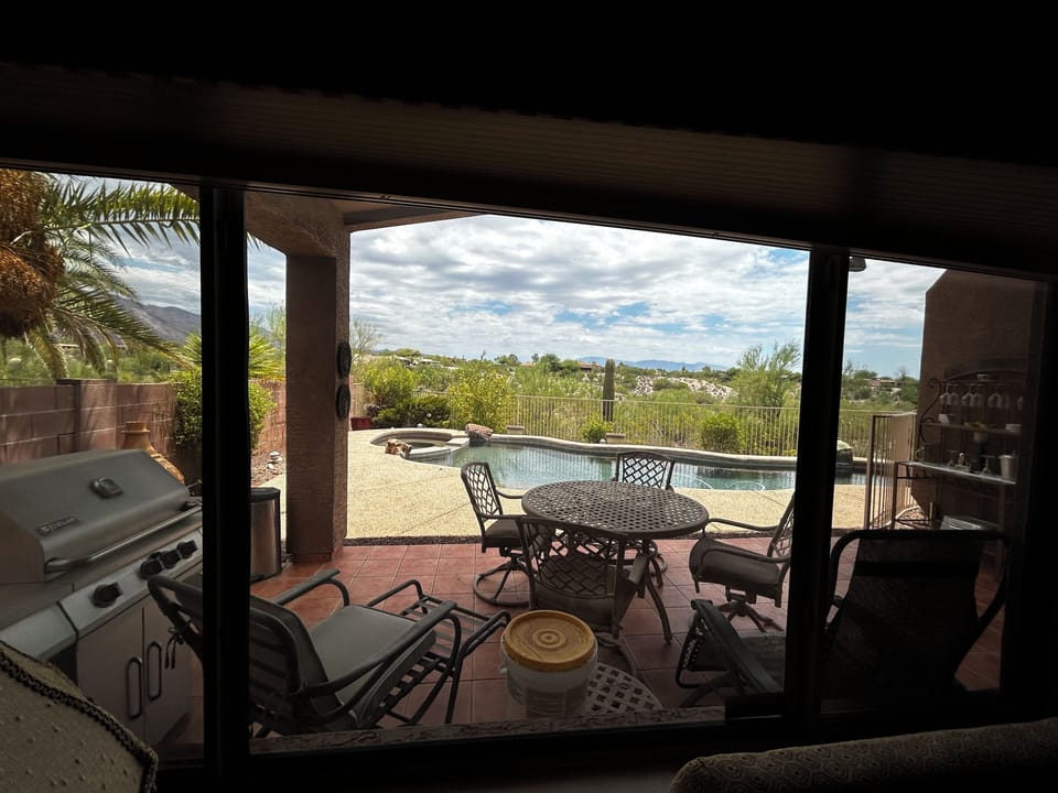Backyard with mountain views, grill, and pool