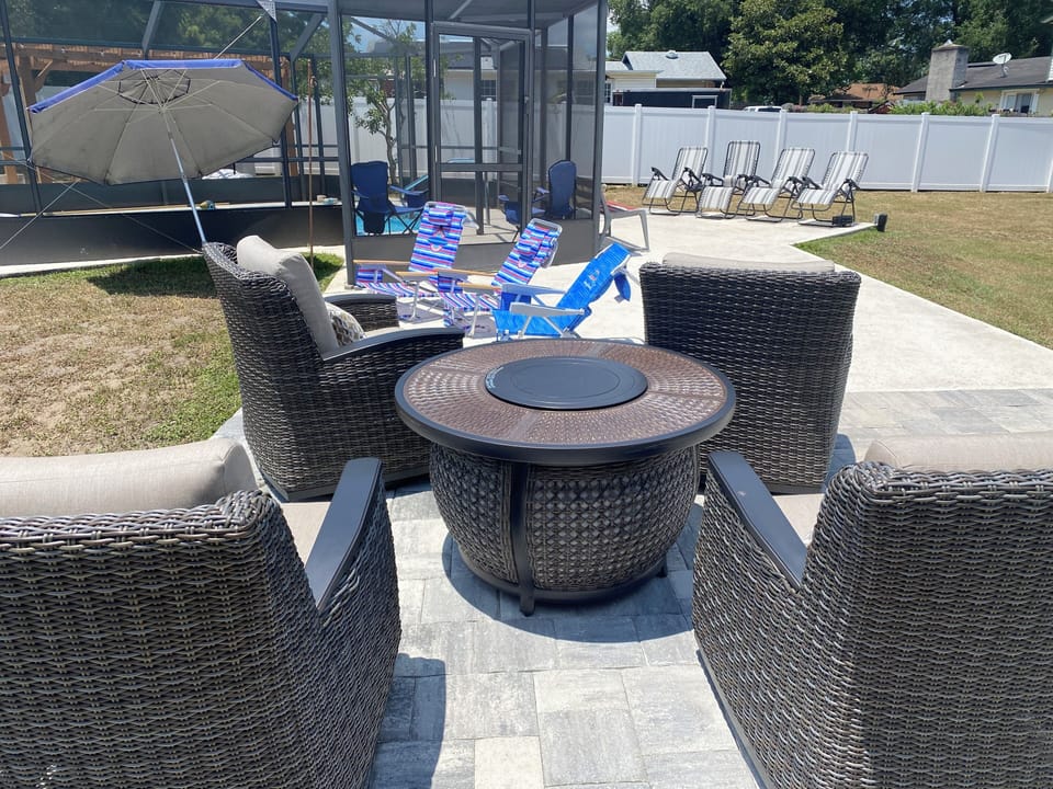 Fire pit, lounge chairs to enjoy the sun.