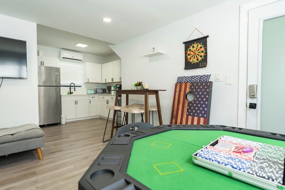 Eat, play, and chill—dining space right by the game table and kitchen.