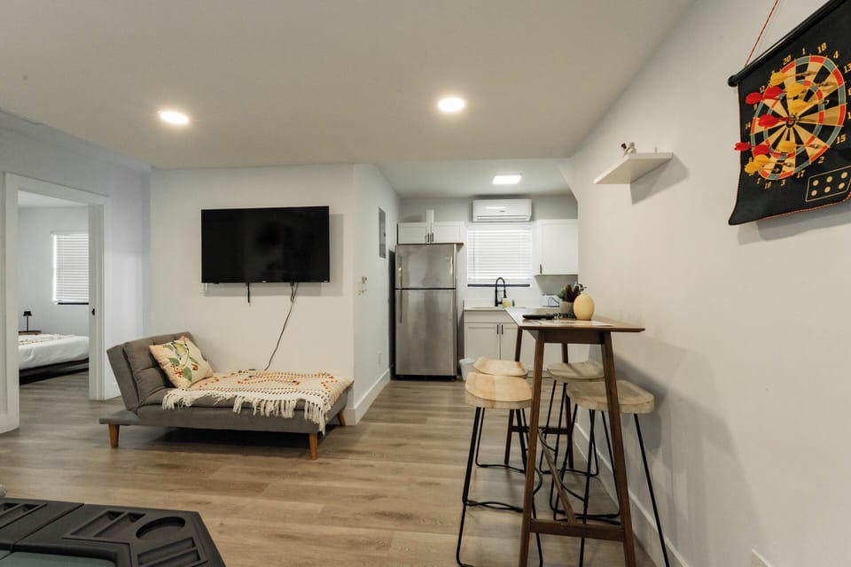 Casual dining setup that flows into the kitchen—perfect for easy meals.