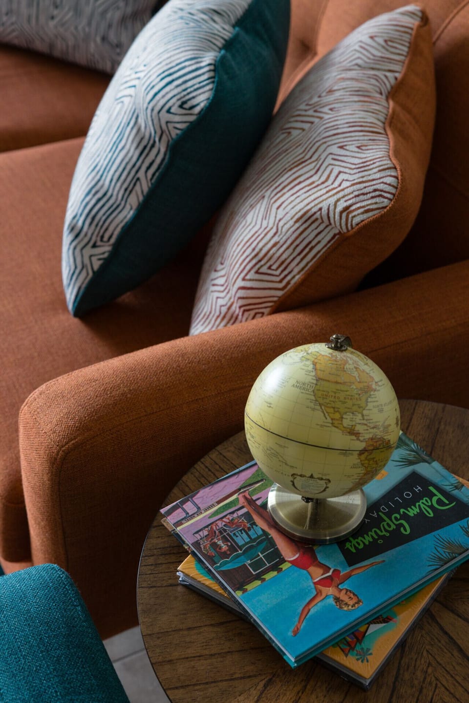 Charming side table with a decorative globe — a little reminder of adventure and wanderlust