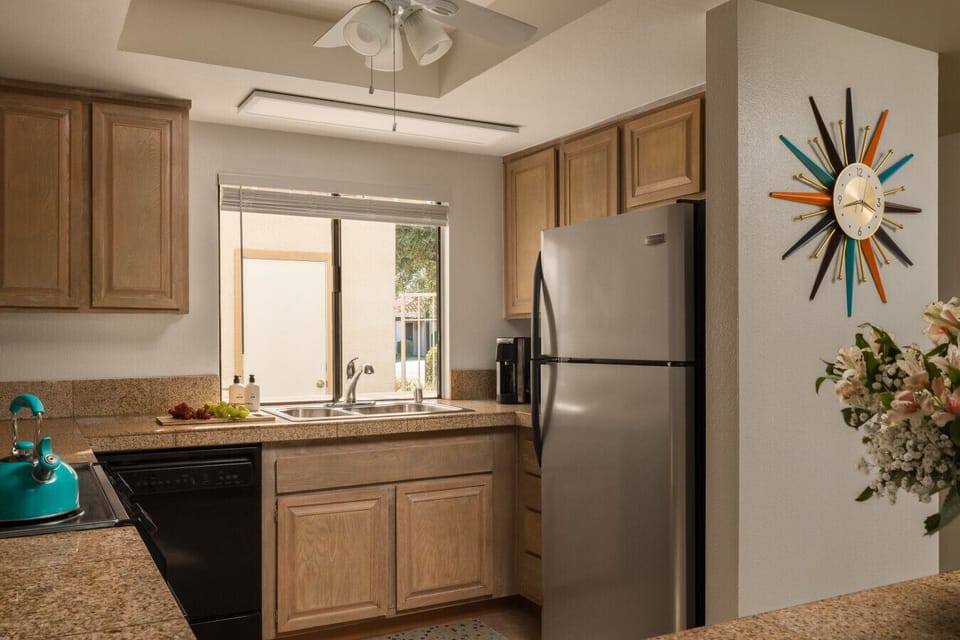Earth-toned kitchen designed for comfort and convenience — cook, dine, and feel right at home.