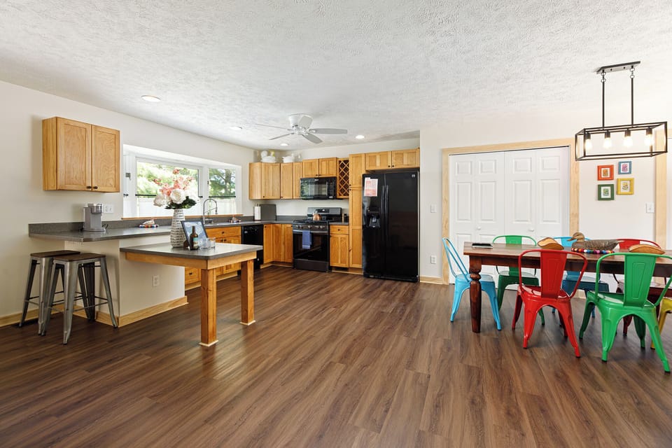 Airy open-concept space connecting kitchen, dining & living areas for easy gathering