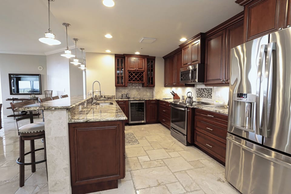 Kitchen with stainless steel appliances and wine cooler
